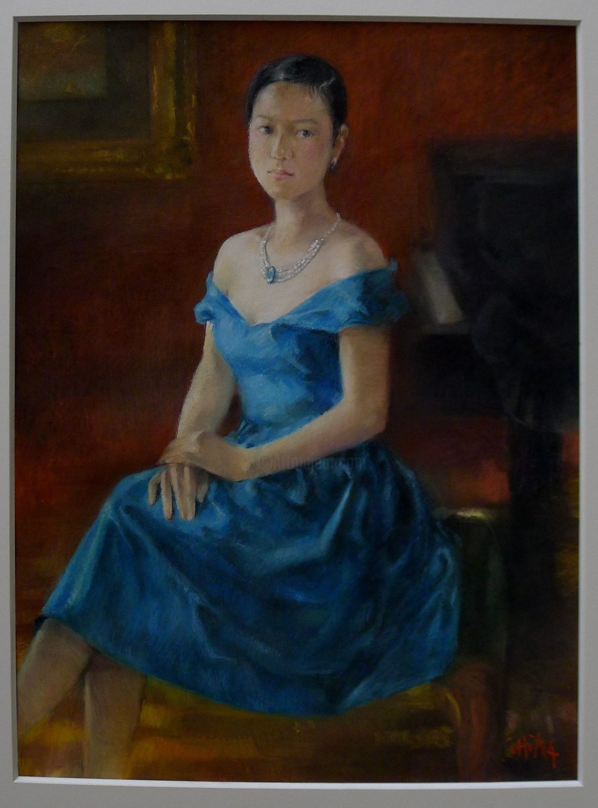 Portrait of a seated woman in a blue dress